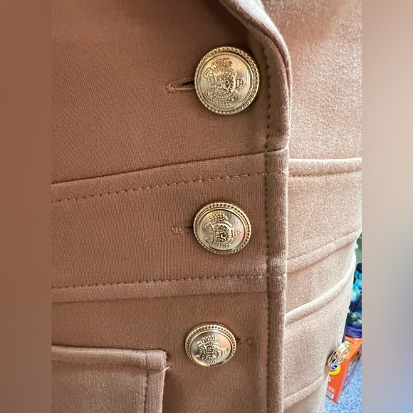 Tan-colored jacket with a structured, tailored design. Gold buttons.Size Medium - Picture 10 of 17